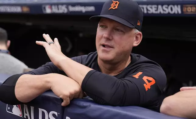 Detroit Tigers manager A.J. Hinch talks in the dugout during a baseball workout in Cleveland, Friday, Oct. 4, 2024, in preparation for the American League Division Series against the Cleveland Guardians. (AP Photo/Sue Ogrocki)