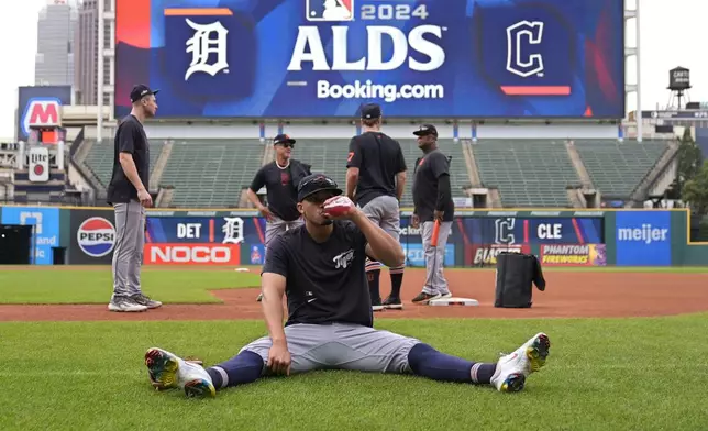 Detroit Tigers' Wenceel Perez takes a drink during a baseball workout in Cleveland, Friday, Oct. 4, 2024, in preparation for the American League Division Series against the Cleveland Guardians. (AP Photo/Sue Ogrocki)