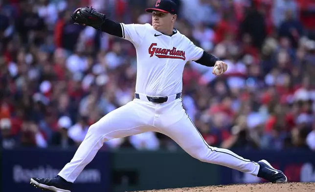 Cleveland Guardians' Erik Sabrowski pitches in the fourth inning during Game 5 of baseball's American League Division Series against the Detroit Tigers, Saturday, Oct. 12, 2024, in Cleveland. (AP Photo/David Dermer)