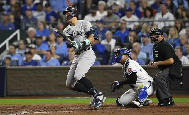 New York Yankees' Aaron Judge doubles during the sixth inning in Game 4 of an American League Division baseball playoff series against the Kansas City Royals Thursday, Oct. 10, 2024, in Kansas City, Mo. (AP Photo/Reed Hoffmann)