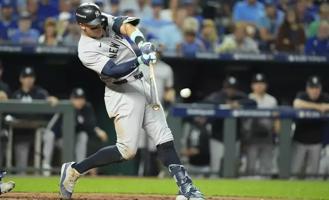 New York Yankees' Aaron Judge doubles during the sixth inning in Game 4 of an American League Division baseball playoff series against the Kansas City Royals Thursday, Oct. 10, 2024, in Kansas City, Mo. (AP Photo/Charlie Riedel)