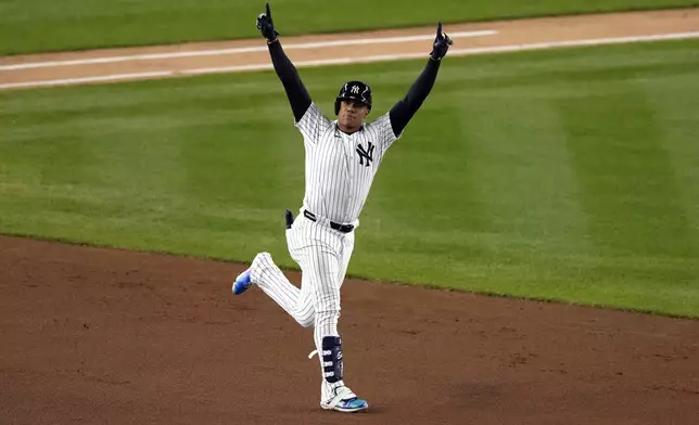 New York Yankees' Juan Soto celebrates after hitting a home run against the Cleveland Guardians during the third inning in Game 1 of the baseball AL Championship Series Monday, Oct. 14, 2024, in New York. (AP Photo/Seth Wenig)