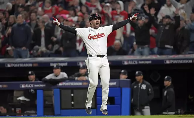 Cleveland Guardians' David Fry celebrates after hitting a game-winning two-run home run against the New York Yankees during the 10th inning in Game 3 of the baseball AL Championship Series Thursday, Oct. 17, 2024, in Cleveland. The Guardians won 7-5. (AP Photo/Jeff Roberson)