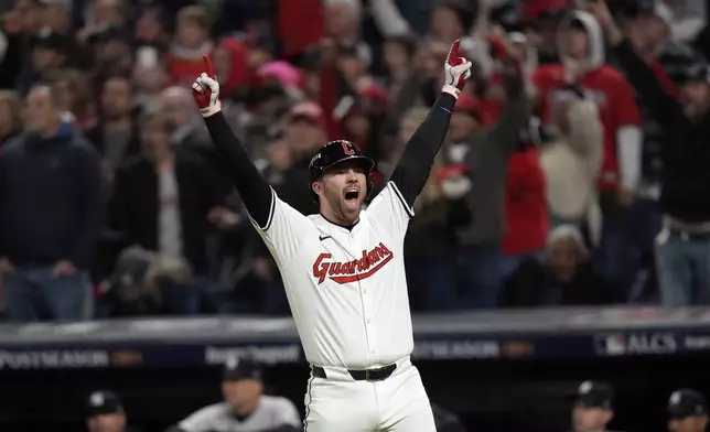 Cleveland Guardians' David Fry celebrates after hitting a game-winning two-run home run against the New York Yankees during the 10th inning in Game 3 of the baseball AL Championship Series Thursday, Oct. 17, 2024, in Cleveland. The Guardians won 7-5. (AP Photo/Jeff Roberson)