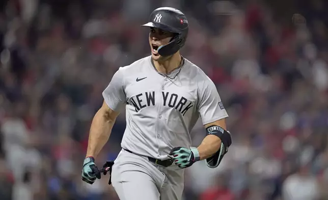 New York Yankees' Giancarlo Stanton celebrates after hitting a two-run home run against the Cleveland Guardians during the sixth inning in Game 5 of the baseball AL Championship Series Saturday, Oct. 19, 2024, in Cleveland. (AP Photo/Godofredo A. Vásquez)