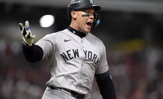 New York Yankees' Aaron Judge celebrates after hitting a two-run home run against the Cleveland Guardians during the eighth inning in Game 3 of the baseball AL Championship Series Thursday, Oct. 17, 2024, in Cleveland.(AP Photo/Godofredo Vásquez )