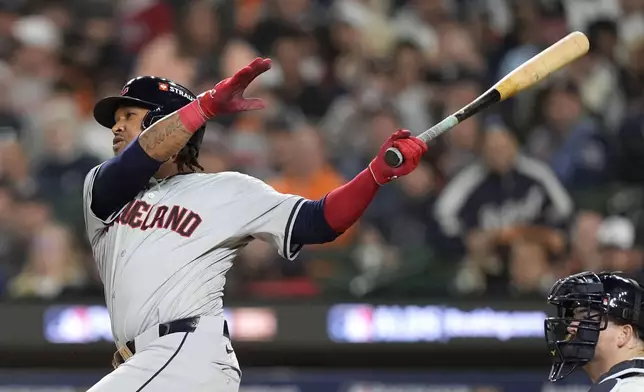 Cleveland Guardians' José Ramírez hits a solo home run in the fifth inning during Game 4 of a baseball American League Division Series against the Detroit Tigers, Thursday, Oct. 10, 2024, in Detroit. (AP Photo/Carlos Osorio)