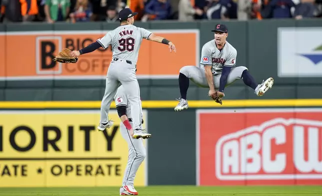 Cleveland Guardians' Steven Kwan (38) celebrates with teammate Will Brennan, right, at the end of Game 4 of a baseball American League Division Series against the Detroit Tigers, Thursday, Oct. 10, 2024, in Detroit. The Guardians won 5-4. (AP Photo/Carlos Osorio)