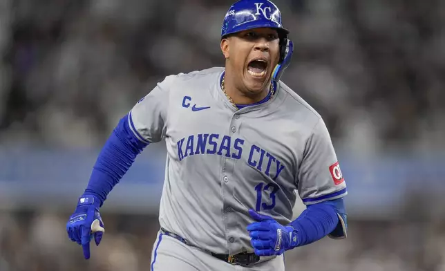 Kansas City Royals' Salvador Perez (13) reacts after hitting a solo home run against the New York Yankees during the fourth inning of Game 2 of the American League baseball playoff series, Monday, Oct. 7, 2024, in New York. (AP Photo/Seth Wenig)