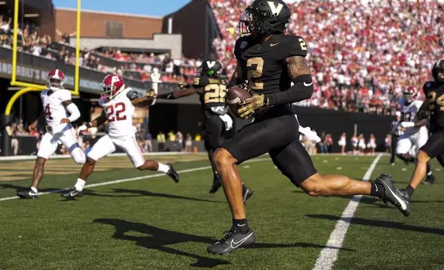 Vanderbilt linebacker Randon Fontenette (2) returns an interception for a touchdown during the first half of an NCAA college football game against Alabama, Saturday, Oct. 5, 2024, in Nashville, Tenn. (AP Photo/George Walker IV)