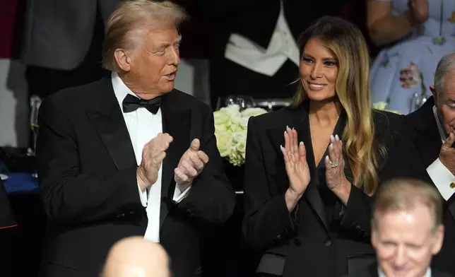 Republican presidential nominee former President Donald Trump and former first lady Melania Trump arrive for the 79th annual Alfred E. Smith Memorial Foundation Dinner, Thursday, Oct. 17, 2024, in New York. (AP Photo/Julia Demaree Nikhinson)