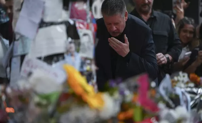 Geoff Payne, the father of former One Direction singer Liam Payne, visits a memorial outside the Casa Sur Hotel where the British pop singer fell to his death from a hotel balcony, in Buenos Aires, Argentina, Friday, Oct. 18, 2024. (AP Photo/Mario De Fina)