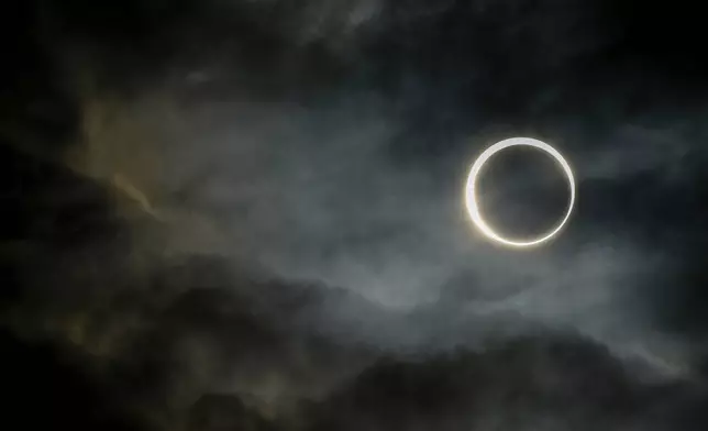 The moon moves past the sun during an annular solar eclipse in Puerto San Julian, Argentina, Wednesday, Oct. 2, 2024. (AP Photo/Natacha Pisarenko)