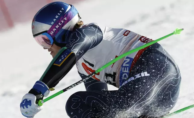 Brazil's Lucas Pinheiro Braathen speeds down the course during an alpine ski, men's World Cup giant slalom, in Soelden, Austria, Sunday, Oct. 27, 2024. (AP Photo/Alessandro Trovati)