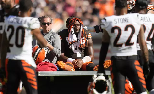 Cleveland Browns quarterback Deshaun Watson (4) is carted off the field after being injured in the first half of an NFL football game against the Cincinnati Bengals, Sunday, Oct. 20, 2024, in Cleveland. (AP Photo/Sue Ogrocki)