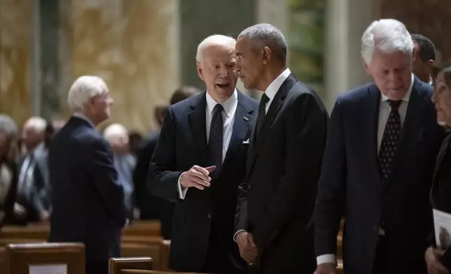 President Joe Biden, left, and former Presidents Barack Obama, center, and Bill Clinton, right, attend a memorial service for Ethel Kennedy, the wife of Sen. Robert F. Kennedy, who died Oct. 10, 2024 at age 96, at the Cathedral of St. Matthew the Apostle in Washington, Wednesday, Oct. 16, 2024. (AP Photo/Ben Curtis)