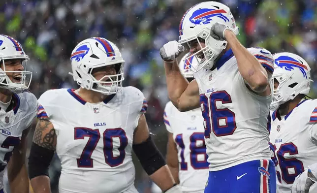 Buffalo Bills tight end Dalton Kincaid (86) celebrates after scoring a touchdown during the first half of an NFL football game against the Seattle Seahawks, Sunday, Oct. 27, 2024, in Seattle. (AP Photo/Lindsey Wasson)