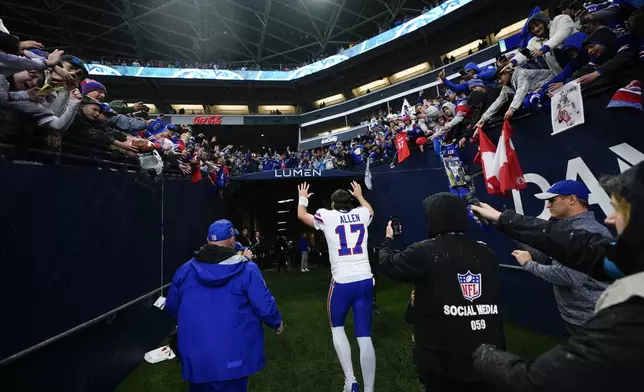 Buffalo Bills quarterback Josh Allen (17) waves to fans after an NFL football game against the Seattle Seahawks, Sunday, Oct. 27, 2024, in Seattle. The Bills won 31-10. (AP Photo/Lindsey Wasson)