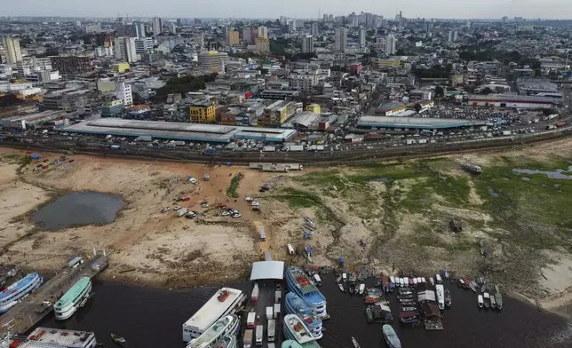 The earth is exposed along the Negro River at the port in Manaus, Amazonas state, Brazil, Friday, Oct. 4, 2024, amid severe drought. (AP Photo/Edmar Barros)