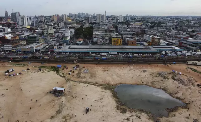 A part of the Negro River is dry at the port in Manaus, Amazonas state, Brazil, Friday, Oct. 4, 2024, amid severe drought. (AP Photo/Edmar Barros)