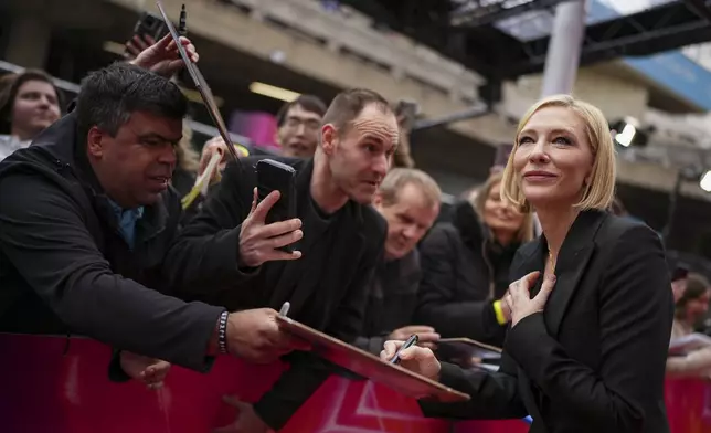 Cate Blanchett signs autographs upon arrival at the premiere for 'Disclaimer' during the London Film Festival on Thursday, Oct. 10, 2024, in London. (Photo by Scott A Garfitt/Invision/AP)