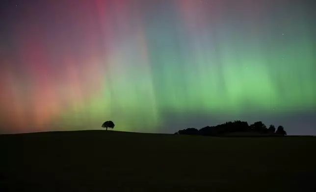 The Northern Lights, also known as the Aurora Borealis, are seen in the sky near Knaresborough, England, Friday, Oct. 11, 2024. (Andrew Hawkes via AP)