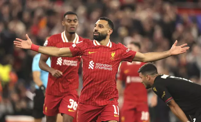 Liverpool's Mohamed Salah celebrates after scoring his side's second goal during the Champions League soccer match between Liverpool and Bologna at the Anfield stadium in Liverpool, England, Wednesday, Oct. 2, 2024. (AP Photo/Ian Hodgson)