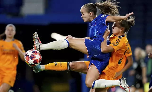 Chelsea's Guro Reiten, front, has a shot on goal during the women's Champions League group B soccer match between FC Chelsea and Real Madrid in London, England, Tuesday, Oct. 8, 2024. (Zac Goodwin/PA via AP)