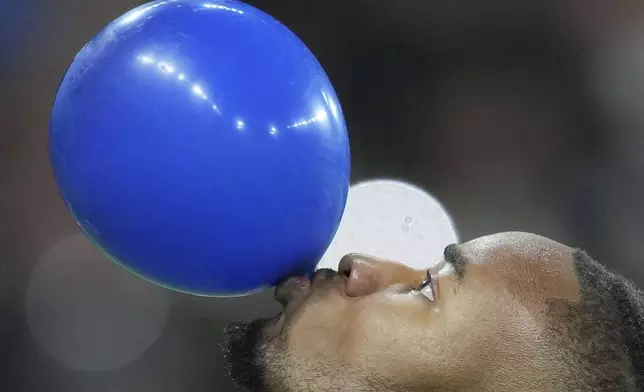 Chelsea's Christopher Nkunku celebrates after scoring his side's third goal during the Europa Conference League opening phase soccer match between Chelsea and Gent at Stamford Bridge in London, Thursday, Oct. 3, 2024. (AP Photo/Kin Cheung)