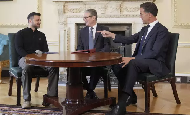 Britain's Prime Minister Keir Starmer, center, NATO Secretary General Mark Rutte, right, and Ukrainian President Volodymyr Zelenskyy meet inside 10 Downing Street in London, Thursday, Oct. 10, 2024.(AP Photo/Kin Cheung, Pool)