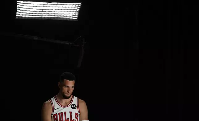 Chicago Bulls guard Zach LaVine sits for a television interview during the team's media day Monday, Sept. 30, 2024, in Chicago. (AP Photo/Charles Rex Arbogast)