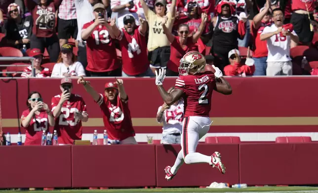 San Francisco 49ers' Deommodore Lenoir (2) returns a blocked field goal for a touchdown during the first half of an NFL football game against the Arizona Cardinals in Santa Clara, Calif., Sunday, Oct. 6, 2024. (AP Photo/Godofredo A. Vásquez)