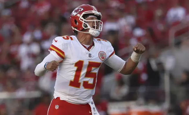 Kansas City Chiefs quarterback Patrick Mahomes (15) celebrates after a touchdown by Mecole Hardman during the second half of an NFL football game against the San Francisco 49ers in Santa Clara, Calif., Sunday, Oct. 20, 2024. (AP Photo/Jed Jacobsohn)