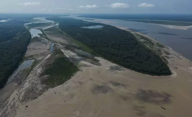 Signs of drought are visible on the Amazon River, near Leticia, Colombia, Sunday, Oct. 20, 2024. (AP Photo/Ivan Valencia)