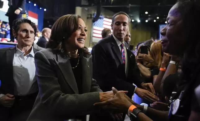 Democratic presidential nominee Vice President Kamala Harris greets members of the crowd after speaking at a campaign event at Lakewood Amphitheatre, Saturday, Oct. 19, 2024, in Atlanta. (AP Photo/Jacquelyn Martin)