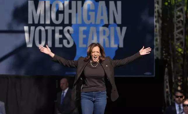 Democratic presidential nominee Vice President Kamala Harris arrives to speak at a campaign rally in Riverside Park, Friday, Oct. 18, 2024, in Grand Rapids, Mich. (AP Photo/Paul Sancya)