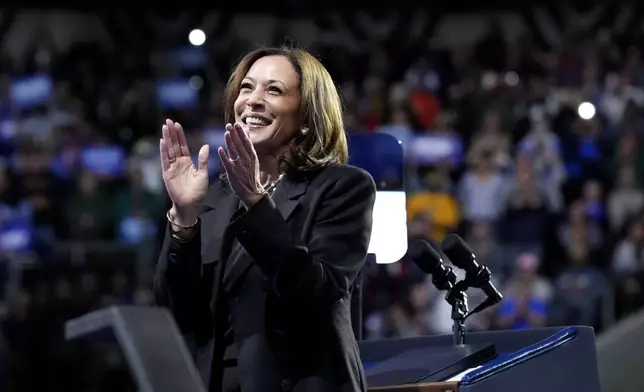 Democratic presidential nominee Vice President Kamala Harris claps on stage during a campaign rally at Erie Insurance Arena, in Erie, Pa., Monday, Oct. 14, 2024. (AP Photo/Jacquelyn Martin)