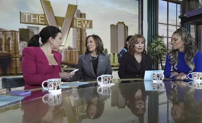 Democratic presidential nominee Vice President Kamala Harris chats with the hosts during a commercial break at The View, Tuesday, Oct. 8, 2024, in New York. Seated from left are Ana Navarro, Harris, Joy Behar and Sunny Hostin. (AP Photo/Jacquelyn Martin)