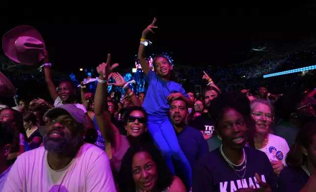 Supporters reacting as they wait for Democratic presidential nominee Vice President Kamala Harris to speak at a rally in Houston, Friday, Oct. 25, 2024. (AP Photo/Susan Walsh)