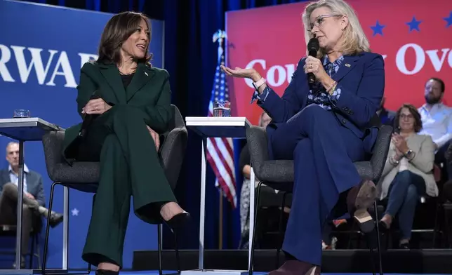 Former Republican Congresswoman Liz Cheney speaks as Democratic presidential nominee Vice President Kamala Harris listens during a town hall at the Royal Oak Theatre in Royal Oak, Mich., Monday, Oct. 21, 2024. (AP Photo/Jacquelyn Martin)