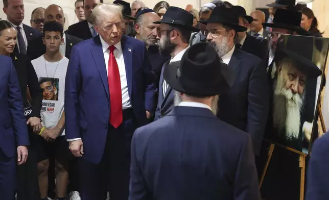 Republican presidential nominee former President Donald Trump arrives at Ohel Chabad-Lubavitch to visit the gravesite of Rabbi Menachem Mendel Schneerson, Monday, Oct. 7, 2024, in New York. (AP Photo/Yuki Iwamura)