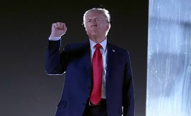 Republican presidential nominee former President Donald Trump gestures as he concludes speaking at a campaign event at the Butler Farm Show, Saturday, Oct. 5, 2024, in Butler, Pa. (AP Photo/Alex Brandon)