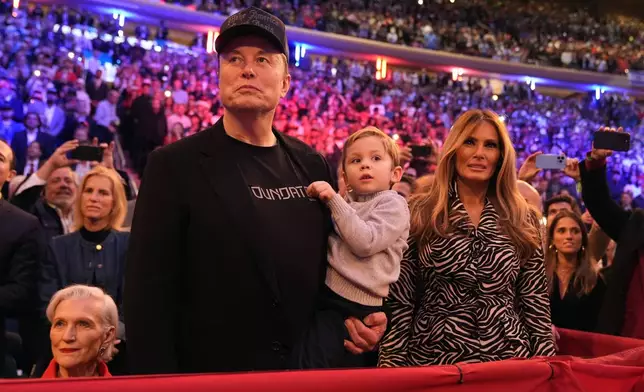 Elon Musk and former first lady Melania Trump listen as Republican presidential nominee former President Donald Trump speaks at a campaign rally at Madison Square Garden, Sunday, Oct. 27, 2024, in New York. (AP Photo/Alex Brandon)