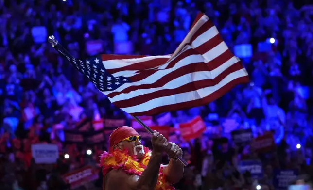 Hulk Hogan waves an American flag at a campaign rally for Republican presidential nominee former President Donald Trump at Madison Square Garden, Sunday, Oct. 27, 2024, in New York. (AP Photo/Julia Demaree Nikhinson)