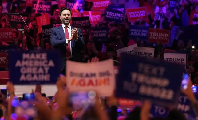 Republican vice presidential nominee Sen. JD Vance, R-Ohio, claps while on stage at a campaign rally for Republican presidential nominee former President Donald Trump at Madison Square Garden, Sunday, Oct. 27, 2024, in New York. (AP Photo/Julia Demaree Nikhinson)