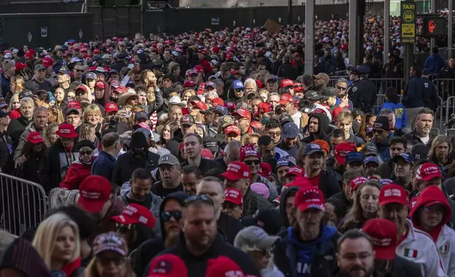 Supporters of Republican presidential nominee former President Donald Trump enter a campaign rally at Madison Square Garden, Sunday, Oct. 27, 2024, in New York. (AP Photo/Yuki Iwamura)