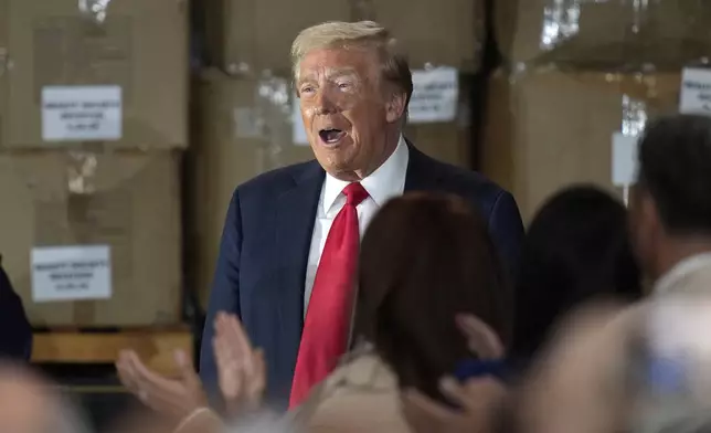 Republican presidential nominee former President Donald Trump arrives to speak at a campaign event at Beauty Society, Saturday, Oct. 12, 2024, in North Las Vegas, Nev. (AP Photo/John Locher)