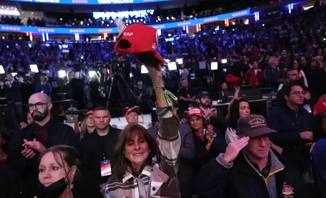 Attendees cheer at a campaign rally for Republican presidential nominee former President Donald Trump at Madison Square Garden, Sunday, Oct. 27, 2024, in New York. (AP Photo/Julia Demaree Nikhinson)