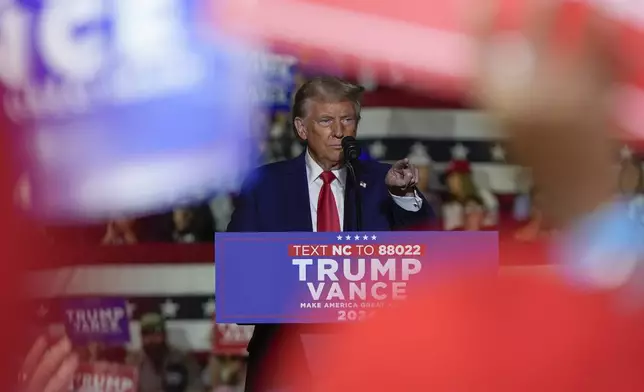 Republican presidential nominee former President Donald Trump speaks at a campaign rally at Williams Arena at Mignes Coliseum, Monday, Oct. 21, 2024, in Greenville, N.C. (AP Photo/Julia Demaree Nikhinson)