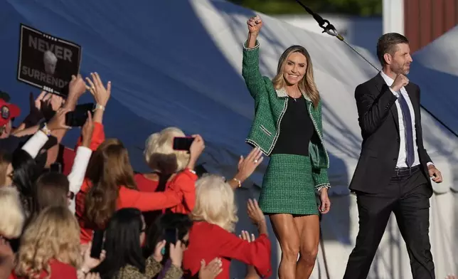 Eric Trump and Republican National Committee co-chair Lara Trump arrive at a campaign rally for Republican presidential nominee former President Donald Trump at the Butler Farm Show, Saturday, Oct. 5, 2024, in Butler, Pa. (AP Photo/Julia Demaree Nikhinson)